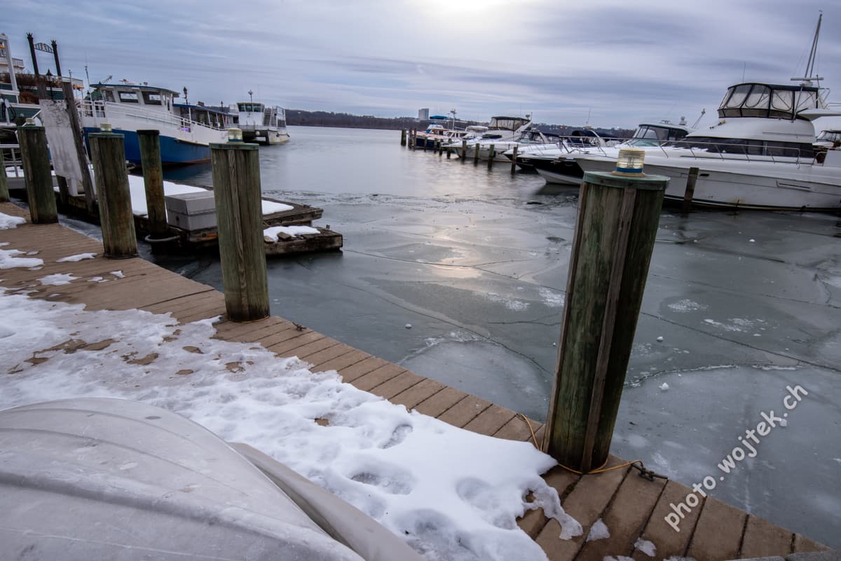 Frozen marina dock with boats Washington DC