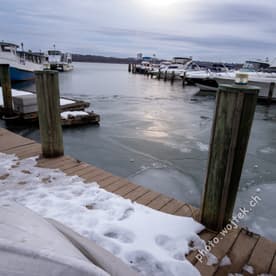 Frozen marina dock with boats Washington DC