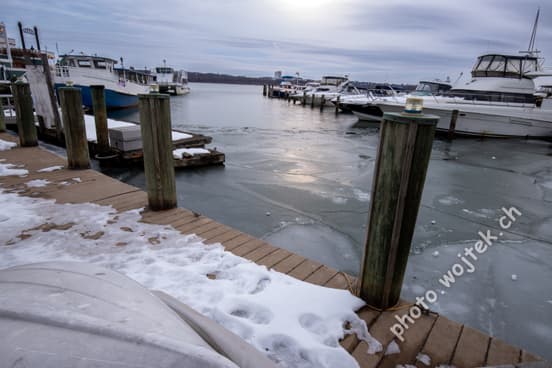 Frozen marina dock with boats Washington DC