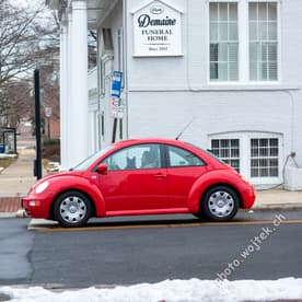 Red Volkswagen Beetle near Demaine Funeral Home Washington DC