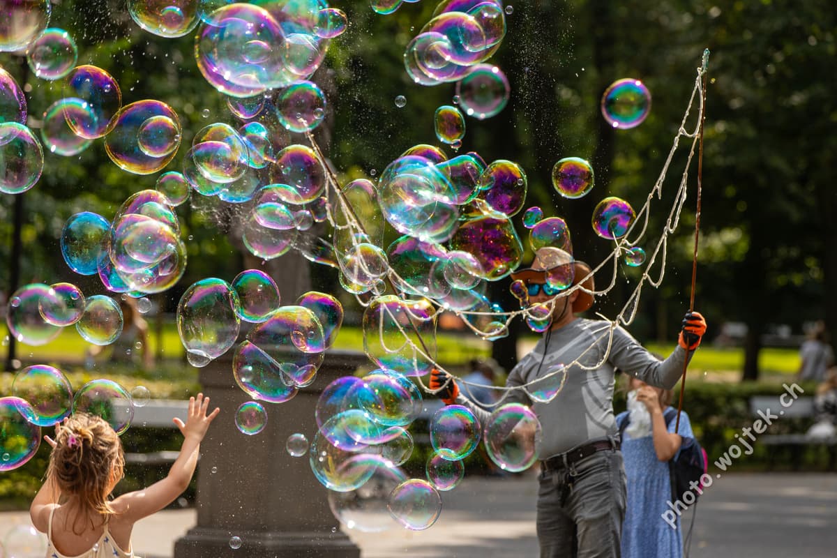 Child playing with bubbles Warsaw Poland