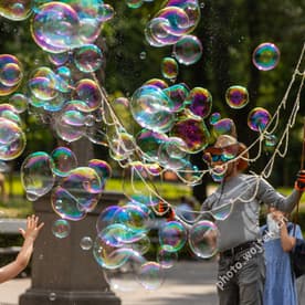 Child playing with bubbles Warsaw Poland