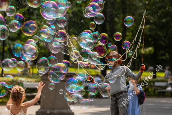 Child playing with bubbles Warsaw Poland