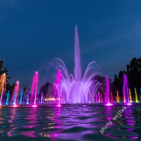 Colorful illuminated fountain at night Warsaw Poland