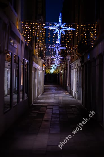 Christmas star lights on narrow street, Venice Italy
