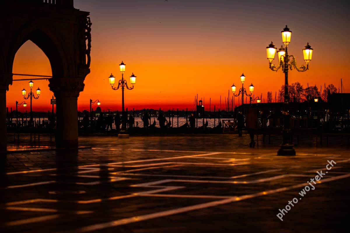 Sunset over gondolas and lampposts, Venice Italy