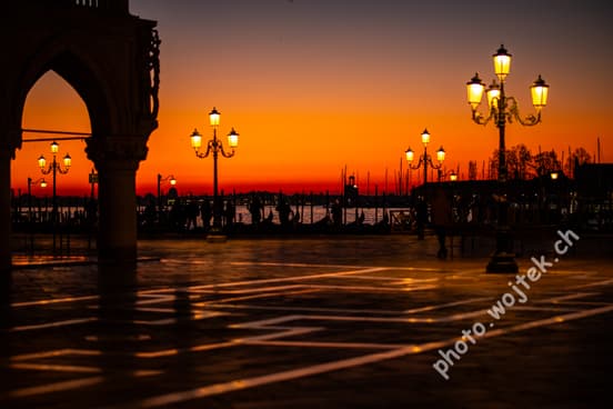 Sunset over gondolas and lampposts, Venice Italy