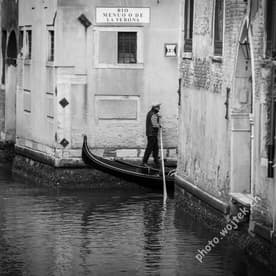 Gondolier on Canal, Venice Italy