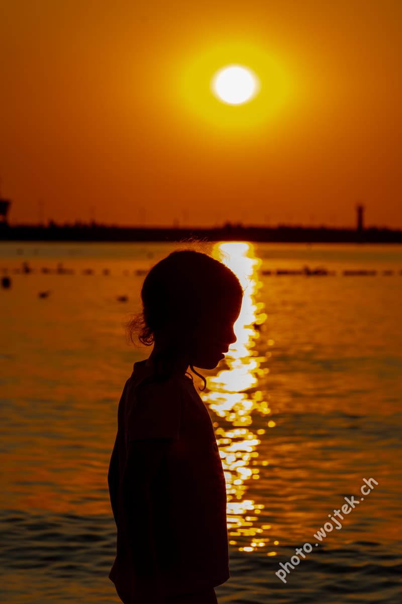 Child silhouette at sunset Kolobrzeg Poland