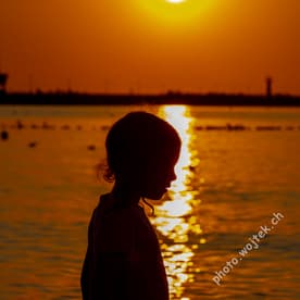 Child silhouette at sunset Kolobrzeg Poland