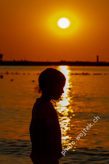 Child silhouette at sunset Kolobrzeg Poland