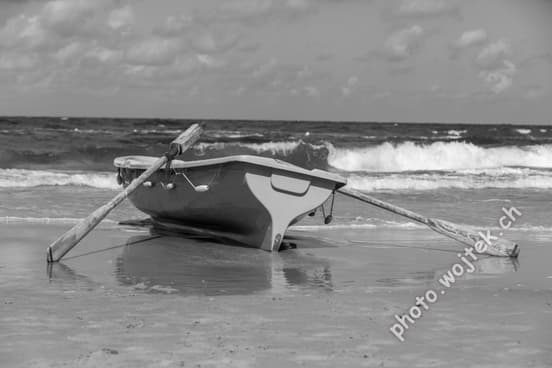 Rowboat on beach shore, Kolobrzeg Poland