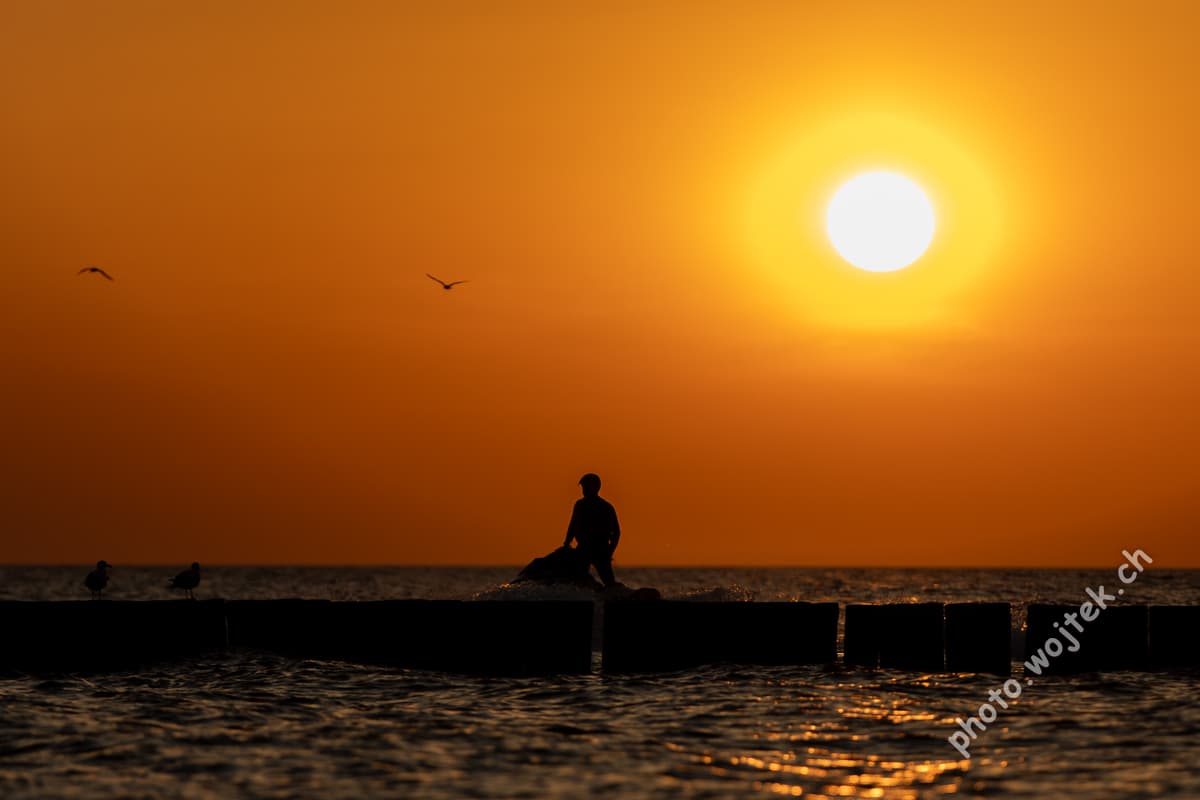 Silhouette of Person at Sunset Kolobrzeg Poland