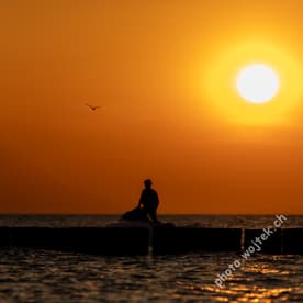 Silhouette of Person at Sunset Kolobrzeg Poland