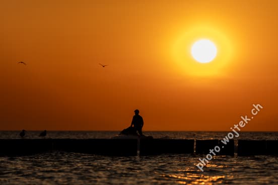 Silhouette of Person at Sunset Kolobrzeg Poland
