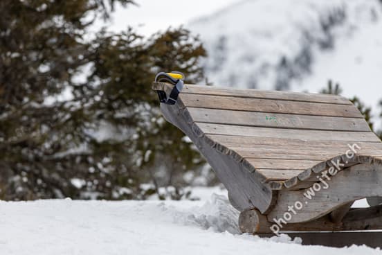Wooden lounge chair with goggles Schladming Austria