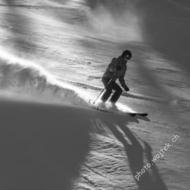 Skier carving snow slope Schladming Austria