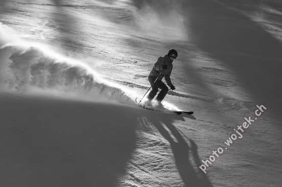 Skier carving snow slope Schladming Austria