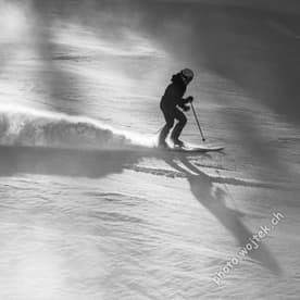 Skier carving snow slope Schladming Austria
