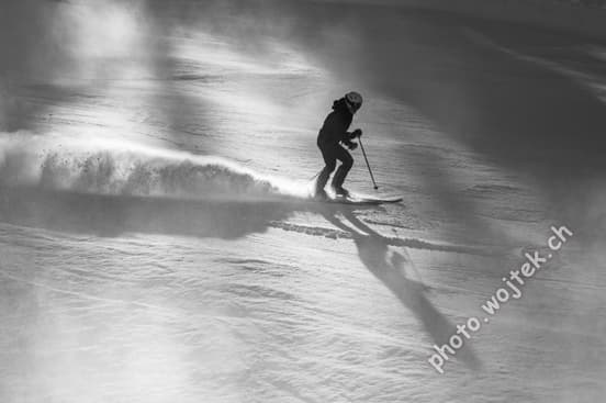 Skier carving snow slope Schladming Austria