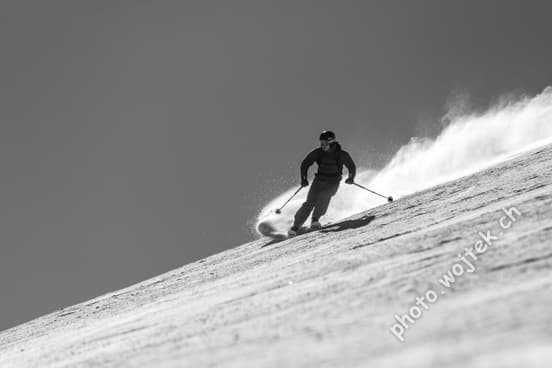 Skier carving snow slope Schladming Austria