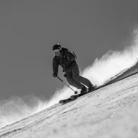 Skier carving snow slope Schladming Austria