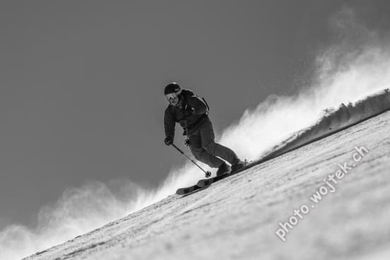 Skier carving snow slope Schladming Austria