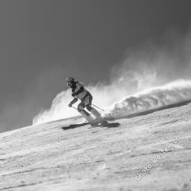 Skier carving snow slope Schladming Austria