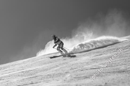 Skier carving snow slope Schladming Austria