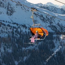 Skier on Chairlift Schladming Austria