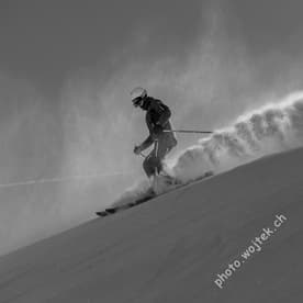 Skier carving powder snow Schladming Austria