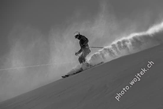 Skier carving powder snow Schladming Austria