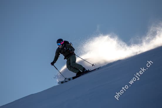 Skier carving powder snow Schladming Austria