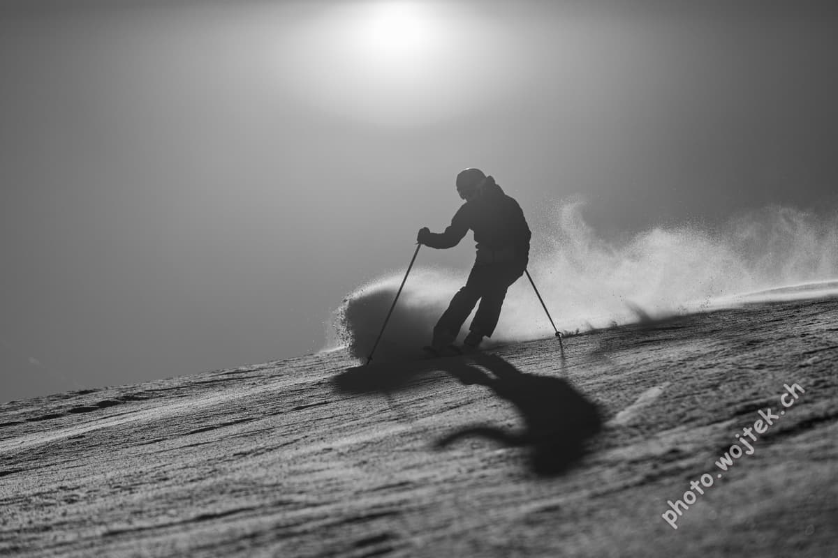 Skier carving snow slope Schladming Austria