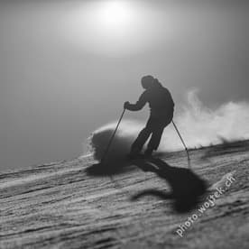 Skier carving snow slope Schladming Austria