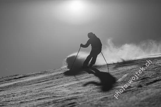 Skier carving snow slope Schladming Austria