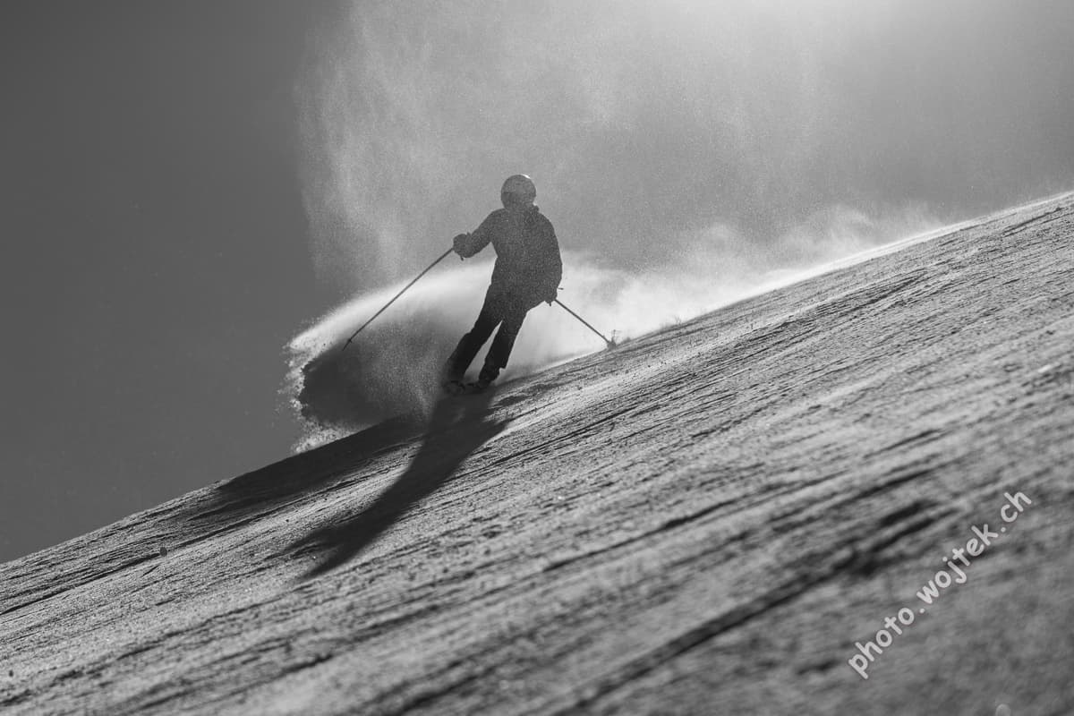 Skier carving snow slope Schladming Austria