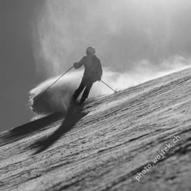 Skier carving snow slope Schladming Austria