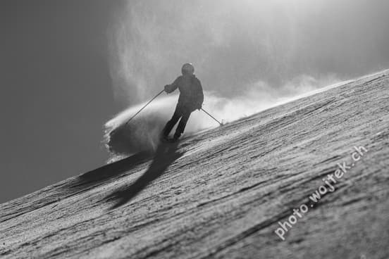 Skier carving snow slope Schladming Austria