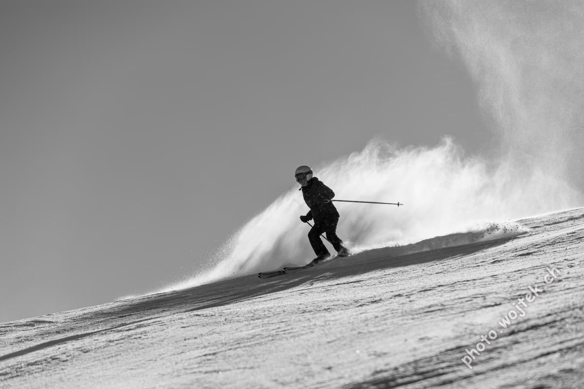 Skier carving snow slope Schladming Austria