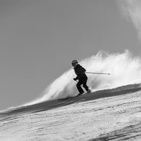 Skier carving snow slope Schladming Austria