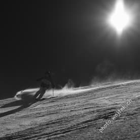 Skier carving snow slope Schladming Austria
