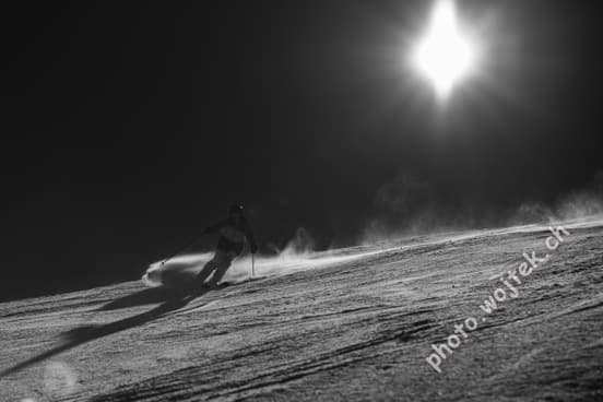 Skier carving snow slope Schladming Austria