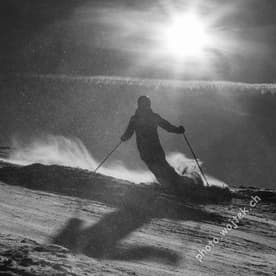 Skier silhouette on snowy slope Schladming Austria