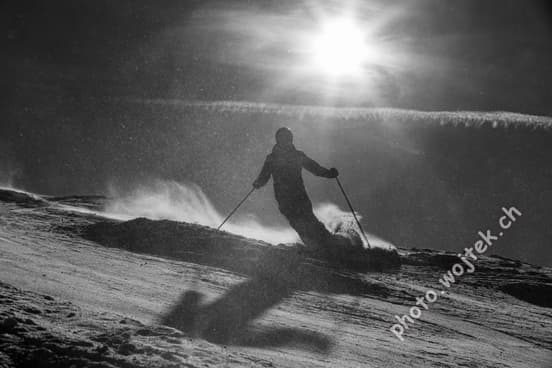 Skier silhouette on snowy slope Schladming Austria