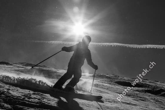 Skier silhouette on slope Schladming Austria