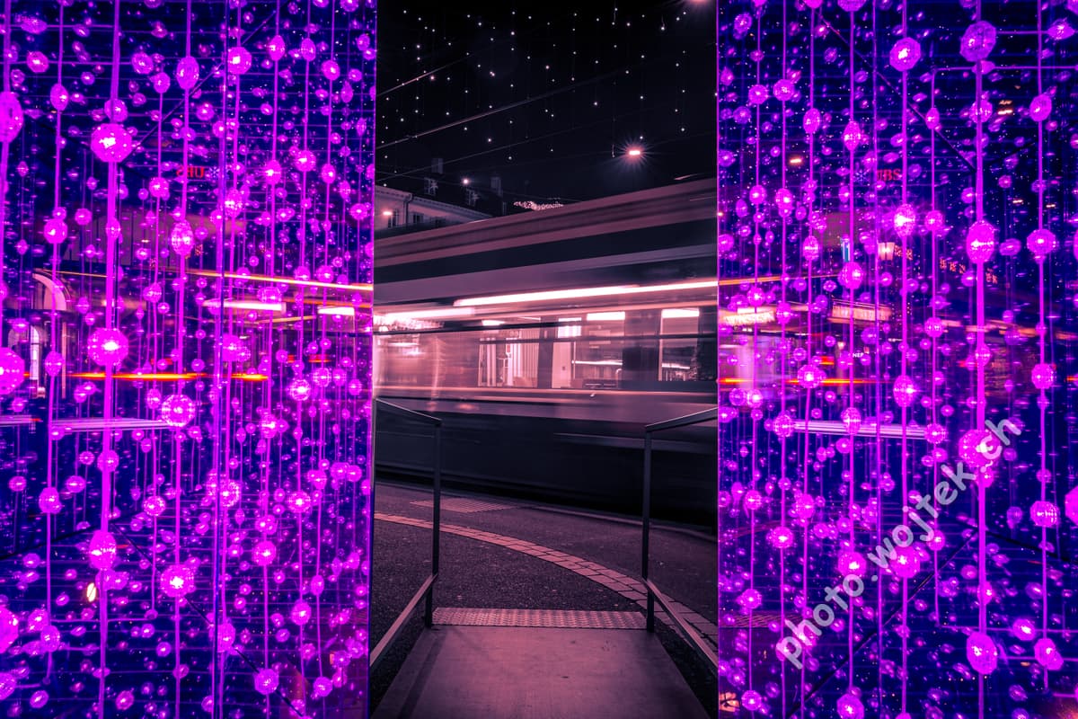 Light installation and tram at night Zürich
