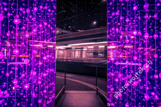 Light installation and tram at night Zürich